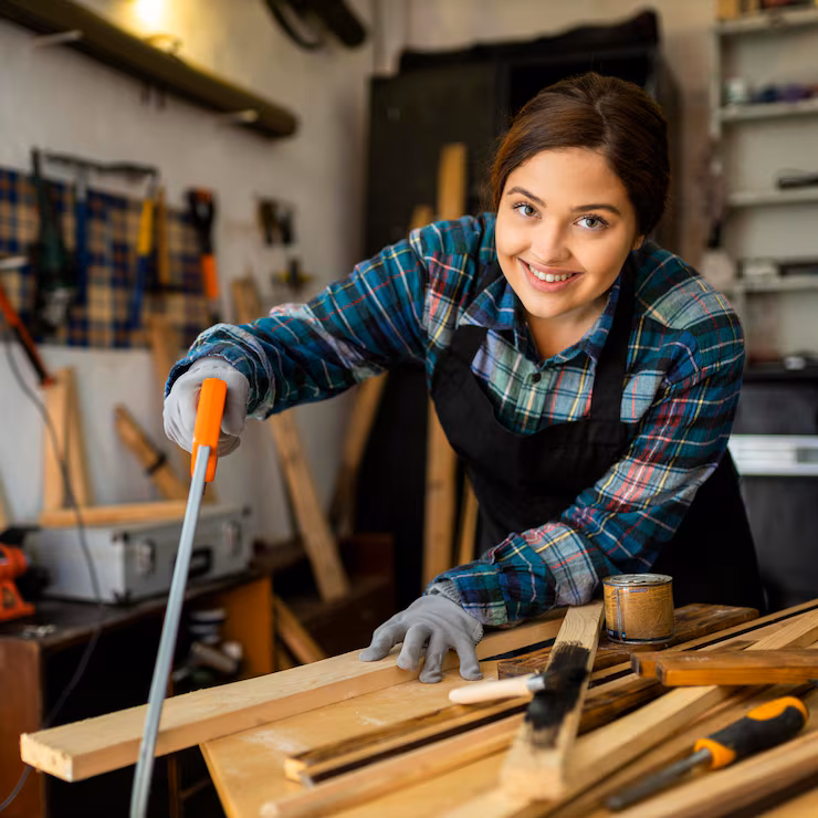 female cutting wood plank 23 2148836061